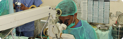 Medical staff performing an eye check-up at a health camp